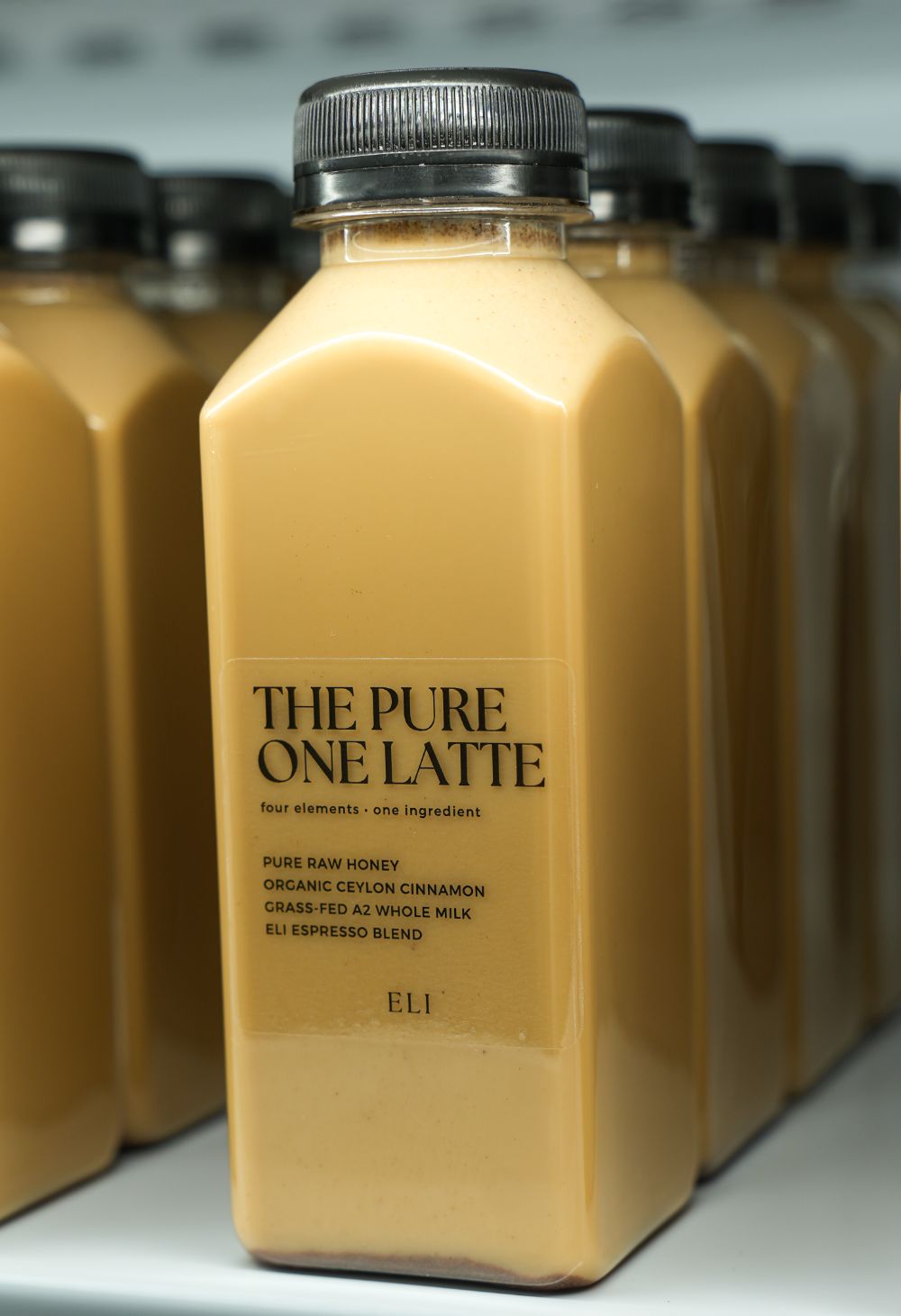 The Pure One Latte bottled, label facing the camera