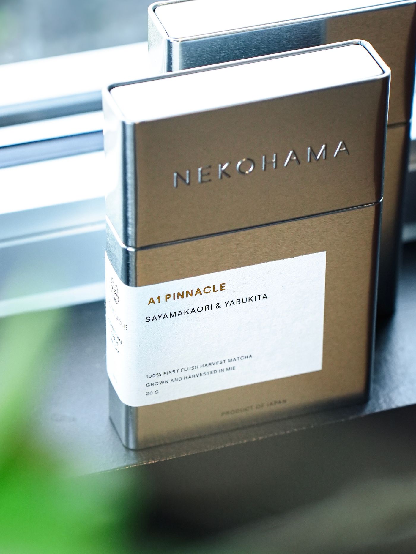 Close-up of a Nekohama A1 Pinnacle tin label: Sayamakaori and Yabukita, 100% first flush harvest matcha grown and harvested in Mie, 20 g